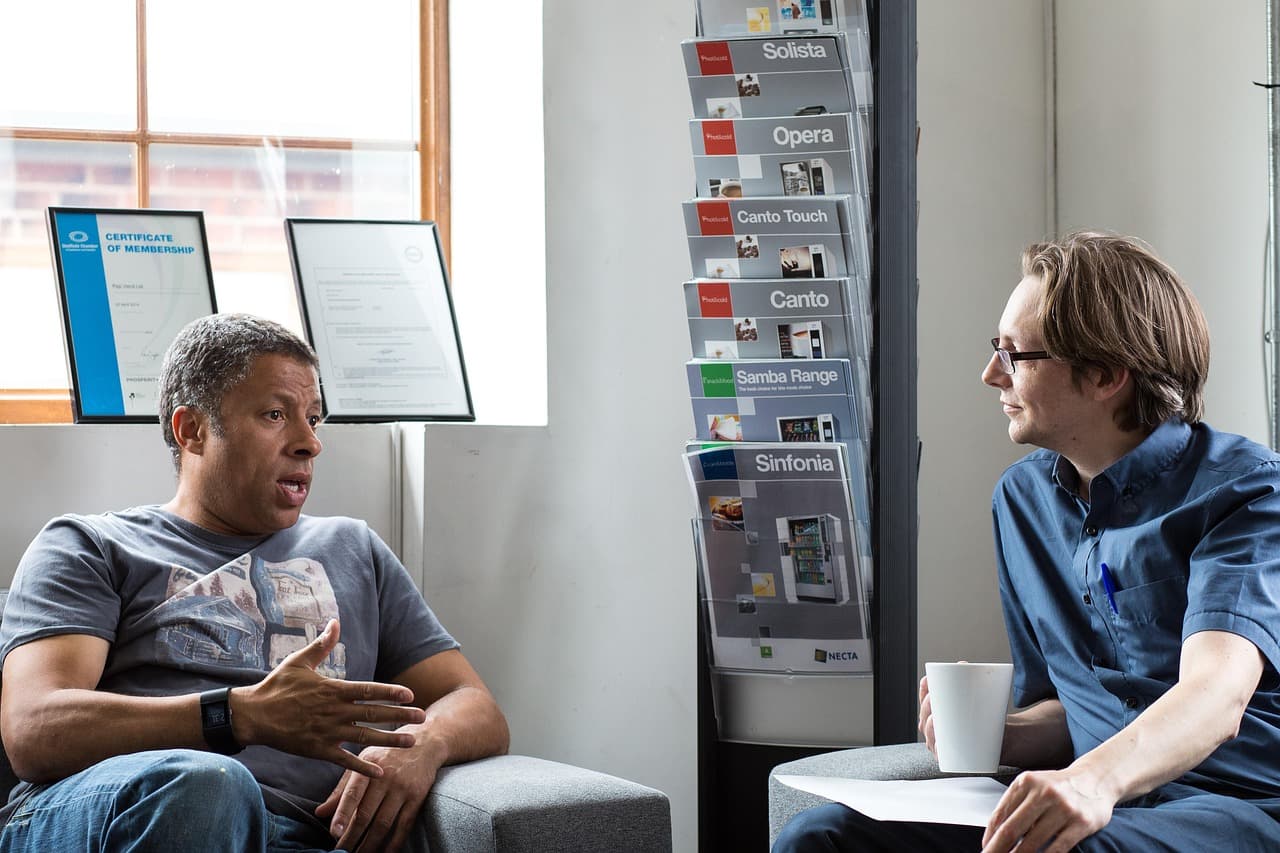 Searchable team in conversation with a client